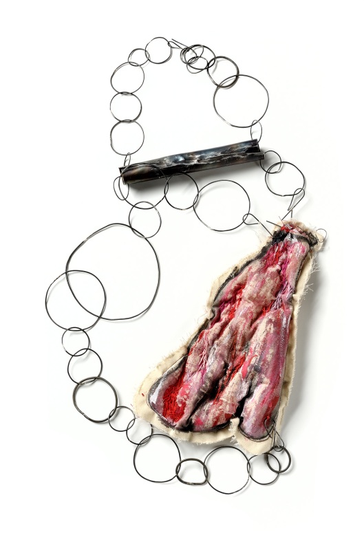 Maru Lopez - Tanta carne y yo sin dientes, 2011. Necklace. Fabric, acrylic, iron. Photo courtesy of the artist.