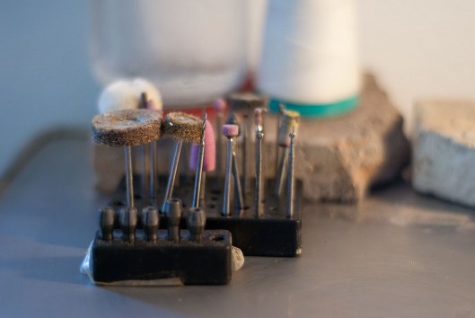 Burs drills and mandrels on Poly's workbench. Photos by Eleni Roumpou