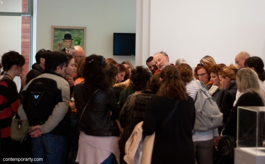 Akis Goumas talking to the visitors of his exhibition at the Benaki Museum. Photograph by Eleni Roumpou